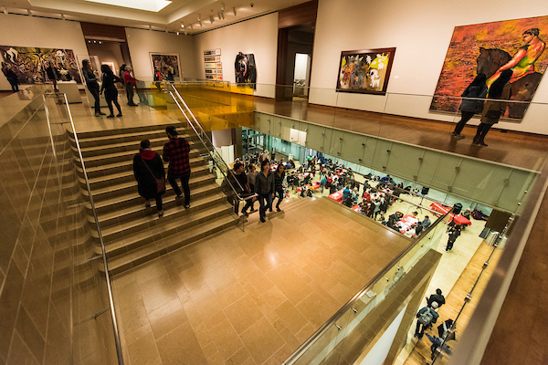 Guests walk up the stairs to explore an upper floor of the Chazen.